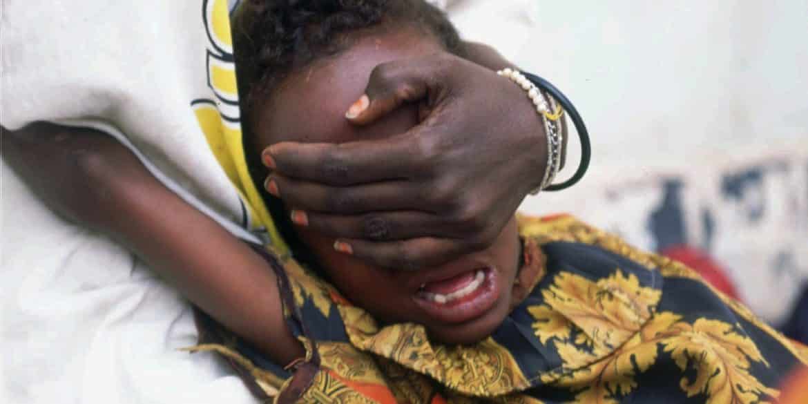 FOR USE WITH FEATURE PACKAGE FOR MONDAY, JULY 8-- Hudan Mohammed Ali, 6, screams in pain while undergoing circumcision in Hargeisa, Somalia, June 17, 1996. Her sister Farhyia Mohammed Ali, 18, holds her so she cannot move.  (AP Photo/Jean-Marc Bouju)