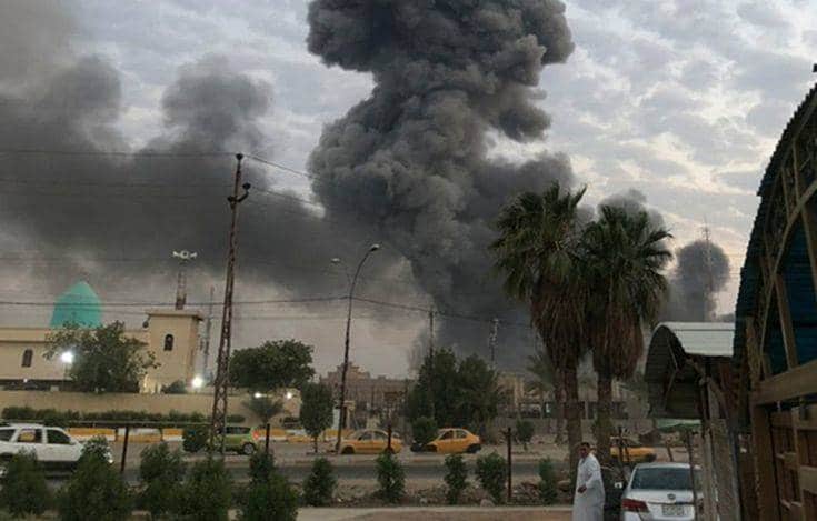 FILE - in this Monday, Aug. 12, 2019 file photo, plumes of smoke rise after an explosion at a military base southwest of Baghdad, Iraq. Israel was responsible for the bombing of an Iranian weapons depot in Iraq last month, U.S. officials have confirmed, an attack that would mark a significant escalation in Israel's long campaign against Iranian military entrenchment in the region. (AP Photo/Loay Hameed, File)