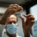 A laboratory assistant holds a tube with Russia's "Sputnik-V" vaccine against the coronavirus disease (COVID-19) at the National Institute of Pharmacy and Nutrition in Budapest, Hungary, November 19, 2020. Matyas Borsos/Hungarian Foreign Ministry/Handout via REUTERS  THIS IMAGE HAS BEEN SUPPLIED BY A THIRD PARTY. NO RESALES. NO ARCHIVES