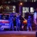 Police officers stand guard on a street after exchanges of gunfire in Vienna, Austria November 3, 2020. REUTERS/Leonhard Foeger