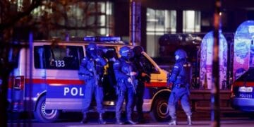 Police officers stand guard on a street after exchanges of gunfire in Vienna, Austria November 3, 2020. REUTERS/Leonhard Foeger