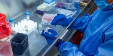 A researcher at the University of Pittsburgh works on a COVID-19 vaccine candidate, a fingertip-sized patch with dissolvable microscopic needles, in Pittsburgh, Pennsylvania, U.S., March 28, 2020.  UPMC/Handout via REUTERS ATTENTION EDITORS - THIS IMAGE WAS PROVIDED BY A THIRD PARTY. MANDATORY CREDIT. NO RESALES. NO ARCHIVES