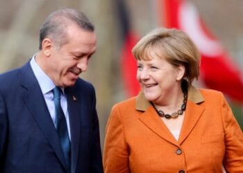 epa03600271 German Chancellor Angela Merkel (R) is greeted with military honors by Prime Minister of Turkey Recep Tayyip Erdogan in Ankara, Turkey, 25 February 2013. German Chancellor Angela Merkel arrived in Turkey 24 February to push forward the country's accession talks with the European Union, even though she remains sceptical about their outcome. She was set to propose on 25 February to Prime Minister Recep Tayyip Erdogan in Ankara that Turkey start negotiations in the areas of economic or regional policies with the EU.  EPA/KAY NIETFELD