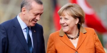 epa03600271 German Chancellor Angela Merkel (R) is greeted with military honors by Prime Minister of Turkey Recep Tayyip Erdogan in Ankara, Turkey, 25 February 2013. German Chancellor Angela Merkel arrived in Turkey 24 February to push forward the country's accession talks with the European Union, even though she remains sceptical about their outcome. She was set to propose on 25 February to Prime Minister Recep Tayyip Erdogan in Ankara that Turkey start negotiations in the areas of economic or regional policies with the EU.  EPA/KAY NIETFELD