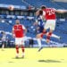 Arsenal's Shkodran Mustafi heads at goal under a challenge from Brighton & Hove Albion's Solly March as play resumes behind closed doors following the outbreak of the coronavirus disease (COVID-19) during the Premier League match between Brighton & Hove Albion and Arsenal, at The American Express Community Stadium, in Brighton, Britain, on June 20, 2020. Photo: Gareth Fuller/Pool via Reuters