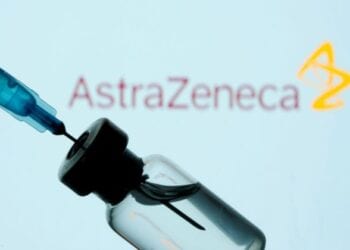 FILE PHOTO: A vial and sryinge are seen in front of a displayed AstraZeneca logo in this illustration taken January 11, 2021. REUTERS/Dado Ruvic/Illustration/File Photo