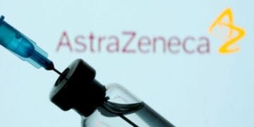 FILE PHOTO: A vial and sryinge are seen in front of a displayed AstraZeneca logo in this illustration taken January 11, 2021. REUTERS/Dado Ruvic/Illustration/File Photo