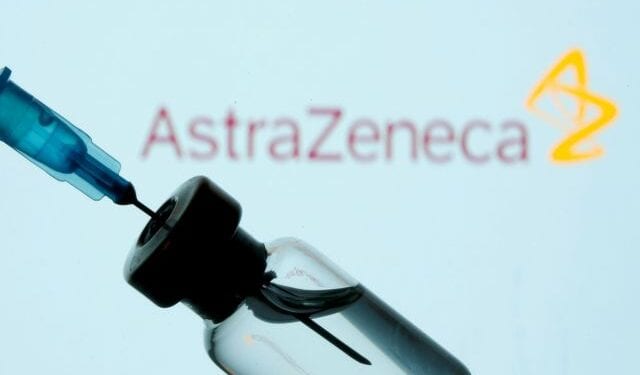 FILE PHOTO: A vial and sryinge are seen in front of a displayed AstraZeneca logo in this illustration taken January 11, 2021. REUTERS/Dado Ruvic/Illustration/File Photo