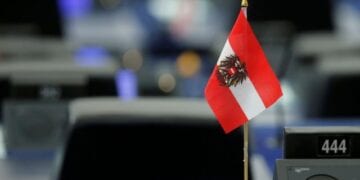 An Austrian flag is seen on the desk of a Member of the European Parliament during a debate at the European Parliament in Strasbourg, France, July 3, 2018. REUTERS/Vincent Kessler