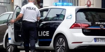 A policeman enters a new Volkswagen e-Golf electric vehicle for Paris police in Paris, France, June 19, 2018.  REUTERS/Charles Platiau