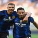 Soccer Football - Italy - Serie A - Inter Milan v Genoa - San Siro, Milan, Italy - August 21, 2021 Inter Milan's Hakan Calhanoglu celebrates scoring their second goal with Edin Dzeko REUTERS/Daniele Mascolo     TPX IMAGES OF THE DAY