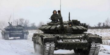 Russian servicemen drive tanks during military exercises in the Leningrad Region, Russia, in this handout picture released February 14, 2022. Russian Defence Ministry/Handout via REUTERS ATTENTION EDITORS - THIS IMAGE HAS BEEN SUPPLIED BY A THIRD PARTY. MANDATORY CREDIT. NO RESALES. NO ARCHIVES.