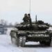 Russian servicemen drive tanks during military exercises in the Leningrad Region, Russia, in this handout picture released February 14, 2022. Russian Defence Ministry/Handout via REUTERS ATTENTION EDITORS - THIS IMAGE HAS BEEN SUPPLIED BY A THIRD PARTY. MANDATORY CREDIT. NO RESALES. NO ARCHIVES.